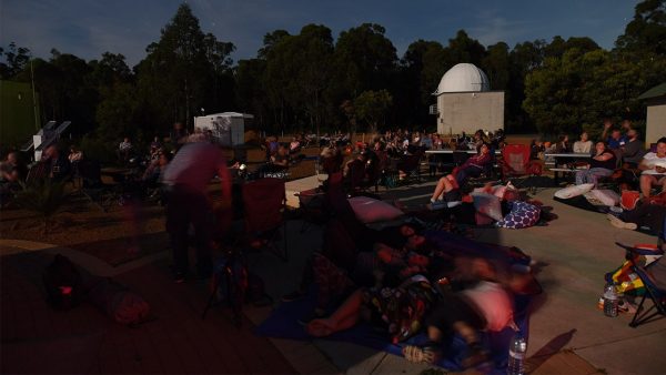 Attendees laying back relaxing at 2019 Geminids Night. Image Credit: Matt Woods