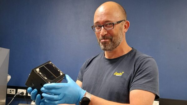 Dr Phil Bland with Binar-1 cubesat. Image Credit: Curtin University