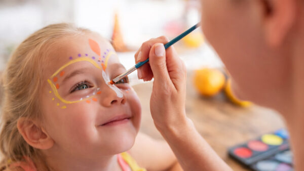 Girl getting her face painted