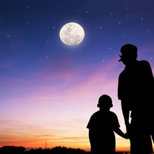 Father and son looking at the Moon