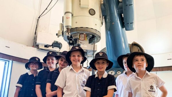 The Lowell Telescope with kids on the telescope tour activity. Image Credt: Matt Woods
