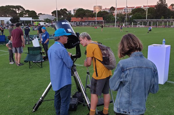 Volunteer Gary showing the Moon through our CPC1100 telescope at Astrofest. Image Credit: ICRAR
